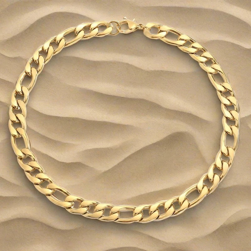 Strong Durable Stainless Steel Figaro Chain Necklace Coated in 14 Karat Gold. 10mm wide by Boujee Ice