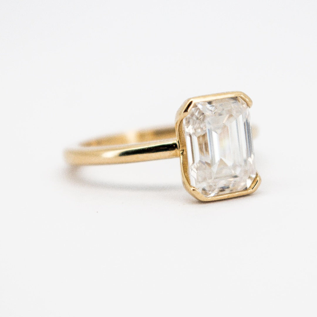 Trending 14 Karat Solid Gold Emerald Cut Diamond Solitaire Bezel Set Ring from Boujee Ice