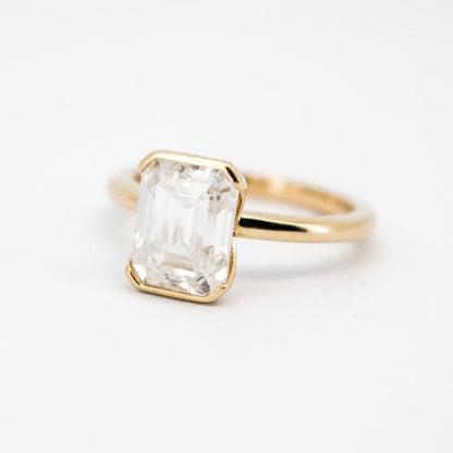 Trending 14 Karat Solid Gold Emerald Cut Diamond Solitaire Bezel Set Ring from Boujee Ice