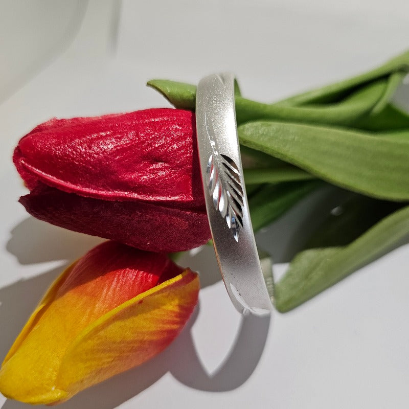 Kiwi Sterling Silver Bangle with Silver Fern Print from Boujee Ice