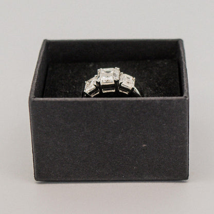Gorgeous Trilogy 3 Stone Emerald Cut ring from Boujee Ice