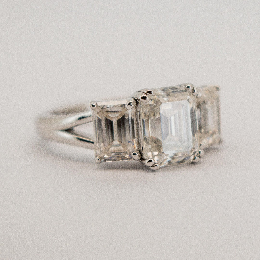 Gorgeous Trilogy 3 Stone Emerald Cut ring from Boujee Ice
