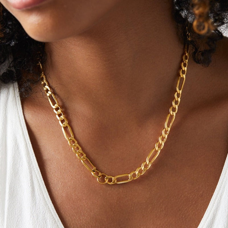 Strong Durable Stainless Steel Figaro Chain Necklace Coated in 14 Karat Gold. 10mm wide by Boujee Ice