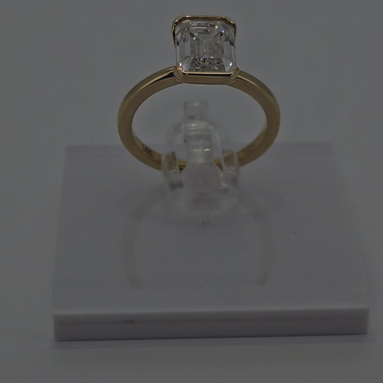 Video of Trending 14 Karat Solid Gold Emerald Cut Diamond Solitaire Bezel Set Ring from Boujee Ice