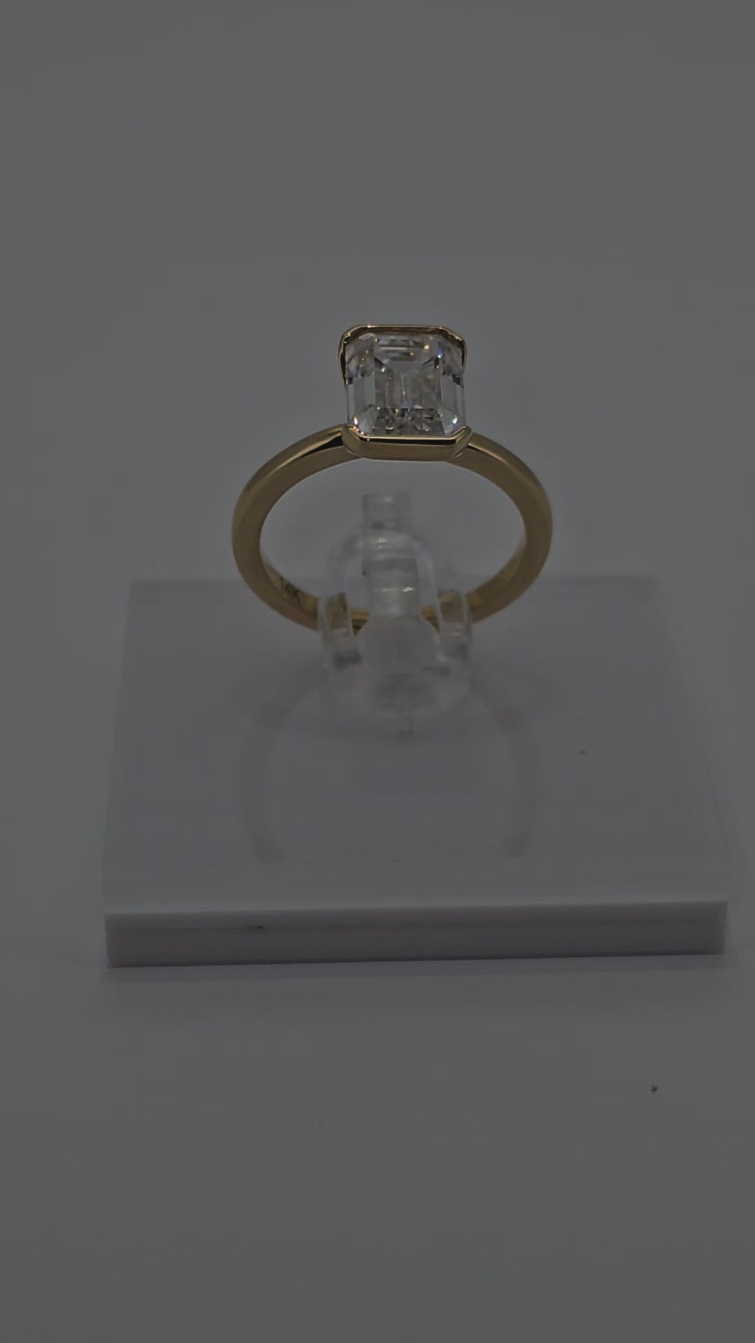 Video of Trending 14 Karat Solid Gold Emerald Cut Diamond Solitaire Bezel Set Ring from Boujee Ice